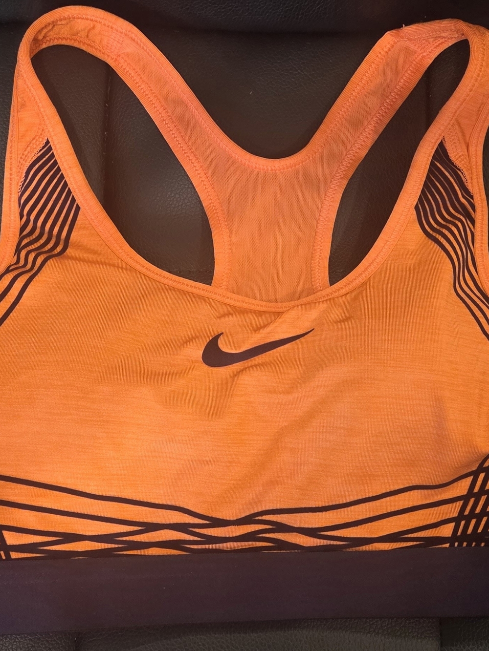 Nike Orange Racerback Sports Bra with Dark Purple Graphic Accents